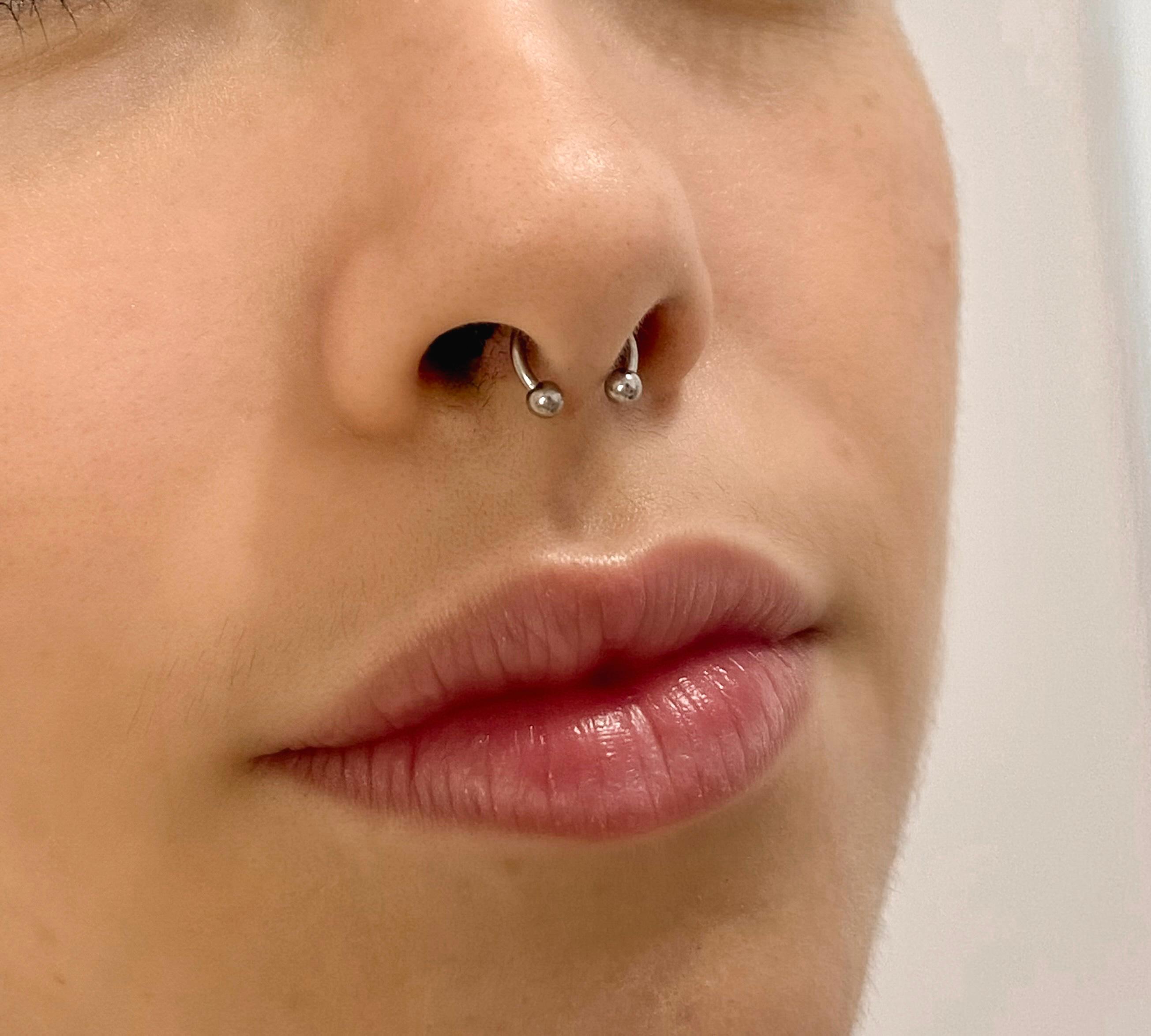 Piercing no septo nasal